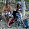 Diony & Ianthe going through the pics @ Cowpens Barbados