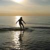 Volker skimming against the sunset @ da skimboardgathering haamstede 24.04.04