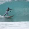 Local surfing a clean barrel@Sandy Lane Barbados