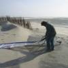 Brian Talma rigging his sail in the storm @ 15 Years Windsurfing Renesse 19.05.06