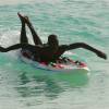 Lifeguard paddling his rescue board @ Miami Beach Barbados