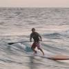 Kyle surfing the Starboard SUP @ Seascape Beach House