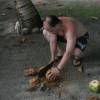 Rachman cutting a coconut @ Seascape Beach House Barbados