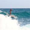 Santa sup surfing a snowy white wave @ Barbados