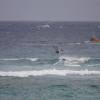 Arjen jumping with the fisherboats in the background @ Silver Sands Barbados