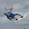 Kiteboarder grabbing his board @ Ocean Spray