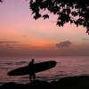 Arjen with his sup board in a caribbean sunset @ the Westcoast of Barbados