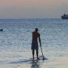 Rower, sup and a ship anchored @ Carlisle Bay Barbados