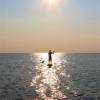 Arjen stand up paddlesurfing in the sunset @ da Brouwersdam