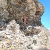 Arjen climbing the coral rock @ the beach